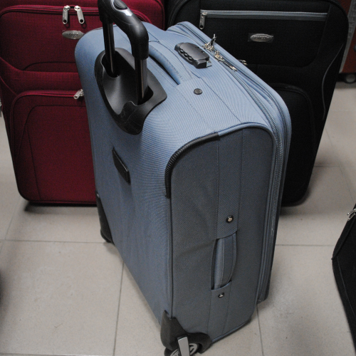 Куфар на колелца среден 64см./40см./26см. платнен сив с допълнителни джобове