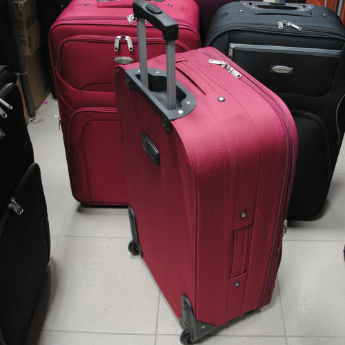 Куфар на колелца среден 64см./40см.26см. платнен червен с допълнителни джобове