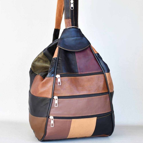 Дамска раница-чанта от естествена кожа с много външни джобчета, тъмни пастелни цветове
